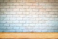 Empty wood table top and brick background with copy space. Royalty Free Stock Photo