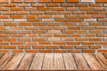 Empty wood table top and brick background with copy space. Royalty Free Stock Photo