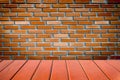 Empty wood table top and brick background with copy space. Royalty Free Stock Photo