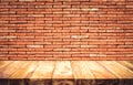 Empty wood table top with brick wall background Royalty Free Stock Photo