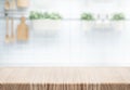 Empty, wood table top counter island on blur kitchen wall Royalty Free Stock Photo