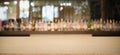 Empty wood table top with Defocused background and bottles of restaurant, bar or cafeteria background. Royalty Free Stock Photo
