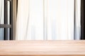 Empty wood table top with Defocused of curtain window in living room with sunlight