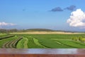 Empty wood table top on Landscape view of tea plantation with blue sky in afternoon, Nature background Royalty Free Stock Photo