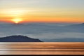 Empty wood table top with mountain background at sunrise Royalty Free Stock Photo