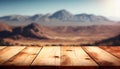 Empty wood table top with the mountain landscape. The blurred landscape of mountains background. Royalty Free Stock Photo