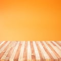 Empty of wood table top on orange pastel color background
