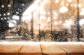 Wood table top with snowfall of winter season background.christmas Royalty Free Stock Photo