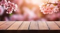 Empty wood tables on blurred background of pink cherry blossom flowers. Generative AI Royalty Free Stock Photo