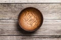 Empty Wooden Bamboo Bowl isolated on wood Background with Real S Royalty Free Stock Photo