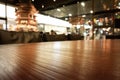 Empty wooden bar counter with defocused background and bottles of restaurant, bar or cafeteria background Royalty Free Stock Photo