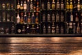 Empty wooden bar counter with defocused background Royalty Free Stock Photo