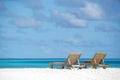 Empty wooden beach chairs on the tropical beach, vacation. Traveler dreams concept Royalty Free Stock Photo