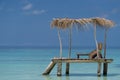 Empty wooden beach chairs on the tropical beach, vacation. Traveler dreams concept Royalty Free Stock Photo