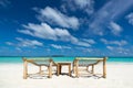 Empty wooden beach chairs on the tropical beach, vacation. Traveler dreams concept Royalty Free Stock Photo