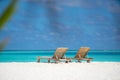 Empty wooden beach chairs on the tropical beach, vacation. Traveler dreams concept Royalty Free Stock Photo