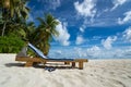 Empty wooden beach chairs on the tropical beach, vacation. Traveler dreams concept Royalty Free Stock Photo