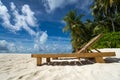 Empty wooden beach chairs on the tropical beach, vacation. Traveler dreams concept Royalty Free Stock Photo