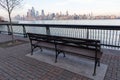 Empty Bench along the Hoboken New Jersey Riverfront along the Hudson River with a view of the New York City Skyline