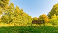 Empty wooden bench in an autumn park in Laubach, Germany Royalty Free Stock Photo