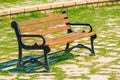 Empty wooden bench standing in the park