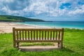 Empty wooden bench in above Porthemor beach Royalty Free Stock Photo