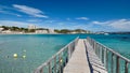 Empty wooden boardwalk leading to Mediterranean Sea