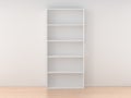 Empty wooden bookcase isolated against the white wall in bright interior Royalty Free Stock Photo