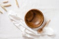 Empty wooden bowl, spoon and ear on cloth. Top view. Eco-friendly concept Royalty Free Stock Photo