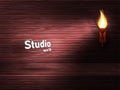 Empty wooden brown studio with a red tinge and recess. Ancient torch with fire illuminates the space.