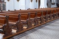 Empty wooden church pews, no people