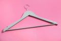 Empty wooden clothes hanger on color Royalty Free Stock Photo