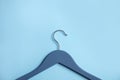 Empty wooden clothes hanger on color background. Royalty Free Stock Photo