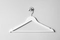 Empty wooden clothes hanger on white wall Royalty Free Stock Photo