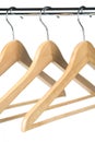 Empty wooden coat hangers on a chrome clothes rail Royalty Free Stock Photo