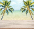 Empty wooden with coconut tree and sea background for product display.