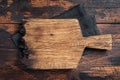 Empty wooden Cutting board over towel on kitchen table, healthy cooking background. Wooden background. Top view. Copy space Royalty Free Stock Photo