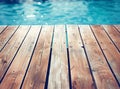 Empty wooden deck with swimming pool Royalty Free Stock Photo