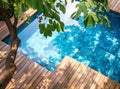 Empty wooden deck with swimming pool Royalty Free Stock Photo