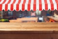 Empty wooden deck table with awing for product montage display Royalty Free Stock Photo