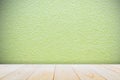 Empty wooden deck table over green paint concrete wall background for present product Royalty Free Stock Photo