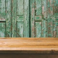 Empty wooden deck table over old wooden background