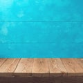 Empty wooden deck table over rustic blue background. Summer nautical