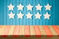 Empty wooden deck table over USA flag background. USA national holidays Royalty Free Stock Photo