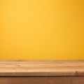 Empty wooden deck table over yellow wallpaper Royalty Free Stock Photo