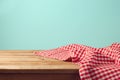 Empty wooden deck table and red checked tablecloth Royalty Free Stock Photo