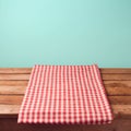 Empty wooden deck table and red checked tablecloth Royalty Free Stock Photo