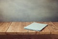 Empty wooden deck table with tablecloth over grunge background. Perfect for product montage display Royalty Free Stock Photo