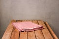 Empty wooden deck table with tablecloth over rustic background Royalty Free Stock Photo