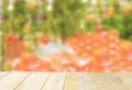 Empty wooden deck table top Ready for product display montage with blurred christmas tree background Royalty Free Stock Photo